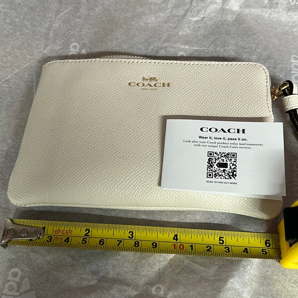 Coach off white wristlet